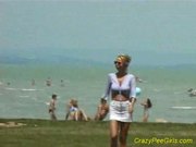 Crazy wizz girl on the beach