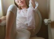 Young skinny brunette shows her pussy