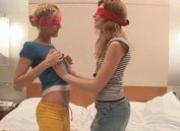 Two young blindfolded babes teasing
