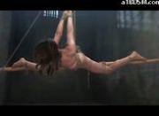 Slim Girl Hanging Tied To Pole In Forward Split Getting Her Mouth And Pussy Fucked In The Dungeon