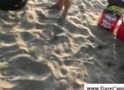Burried beach guy gets dick to his head