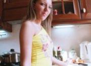 Dildoing pussy in the kitchen