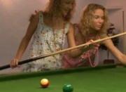 Girls licking on the billiards table
