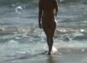 Girls breasts exposed on beach