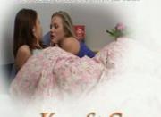 A brunette and a blonde teen having lesbo sex