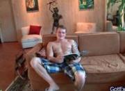 Muscled guy with tats jerking on sofa