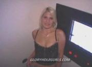 Blonde slut sucking anonymous cocks in a dirty gloryhole booth