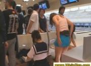 Asian girls playing bowling