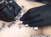 Amateur public slut gets tattoo