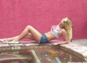 sexy blonde sucks cock by the pool