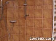 Blonde masturbates in the shower