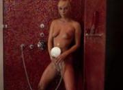 Unbelievable blonde model in a shower