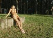 Brunette perfect smoking in wood