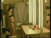 Blonde strips and admires herself in mirror