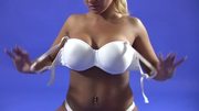 Busty blonde shows nude gymnastics