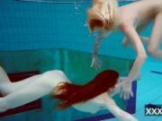 Milana and Katrin strip eachother underwater