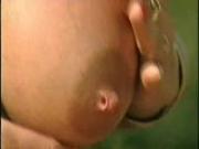 German girl plays with her large pierced nipples