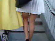 Upskirt voyeur movie. White dress girl on upstairs