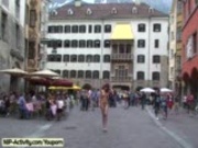 Naked redhead has fun in public streets