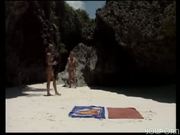 Two tanned beautiful girls play in the sand [CLIP]