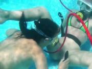 Underwater lesbians lick and suck dildos