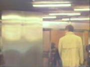 Girl walks topless trough metro station