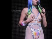 MILEY CYRUS SHOWS OFF HER SLIM BODY WITH HUGE DILDO ON A STAGE