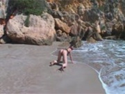 Krystal kicks back naked on the beach