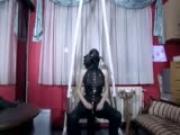 Latex kink girl sucks on her gag