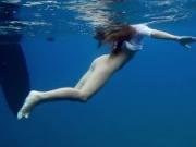 Underwater romantic nude swimming