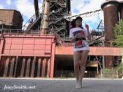 Jeny Smith is walking naked through an abandoned factory.