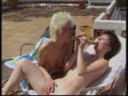 Rubbing their clits with the dildo