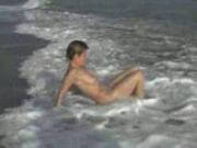 Tigra\'s terrific body tossed around in the surf
