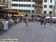 Naked redhead has fun in public streets