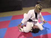 Girls wrestling in kimonos pindown match