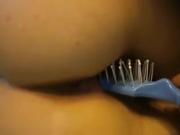 Hot chick get hairbrush shoved in her cunt, spikey part up!