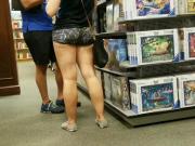 Candid Nerdy female in tiny shorts.