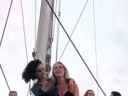 Nina Dobrev dancing with a blonde friend on a boat