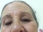 An old woman shows herself