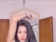 Beautiful brunette stripping and dancing