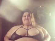 Mature SBBW teases her enormous belly in black sexy dress