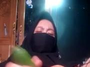 Bangladeshi hijab girl materbating with cucumber
