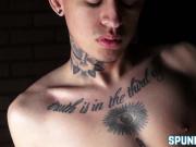 Inked twink teasing while stroking cock passionately solo