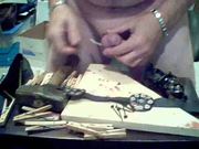 cock nailed to board n spiked cockring crown with weights
