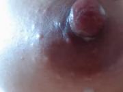 Milks her tits, rubs and fingers her pussy and squirts
