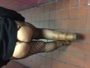 Wife walking in hallway in fishnets