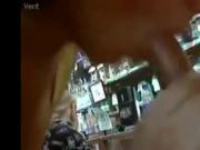 Two girls giving blowjob in shop