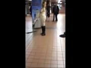 Naked woman in public dancing to subway band