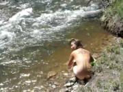 taking a bath at the river