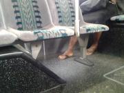 Candid mature feet on bus